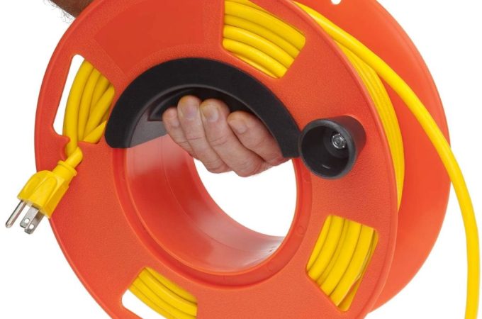 Bayco KW-110 orange cord reel shown coiled neatly, ideal for organized cable storage.