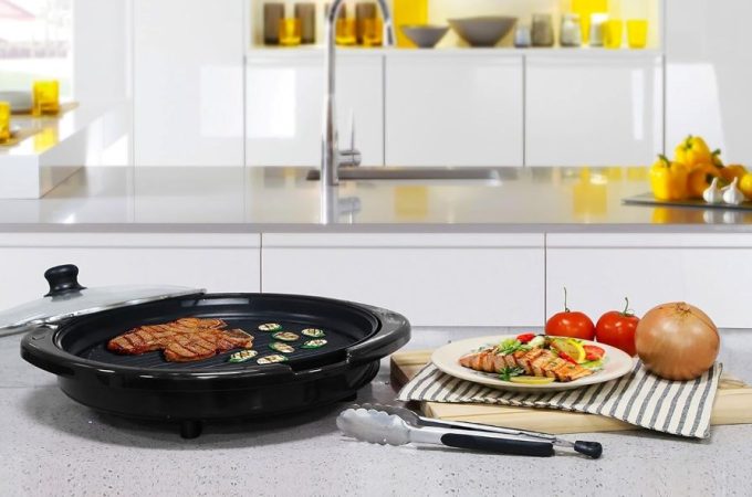 Elite Gourmet 14-inch smokeless electric grill with nonstick surface, ideal for indoor tabletop BBQ cooking.