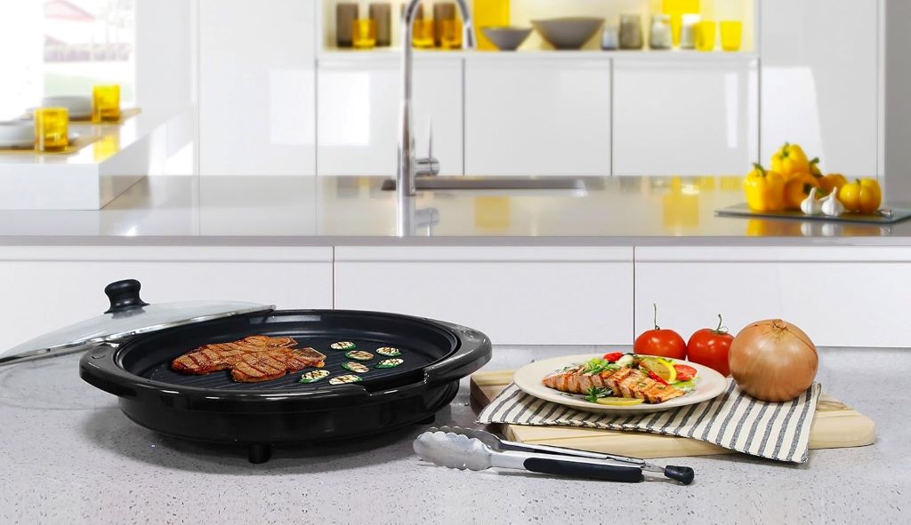 Elite Gourmet 14-inch smokeless electric grill with nonstick surface, ideal for indoor tabletop BBQ cooking.