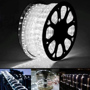 Creative patio setup with Jnaurb 100ft LED rope lights outlining garden edges in waterproof, color-shifting brilliance.