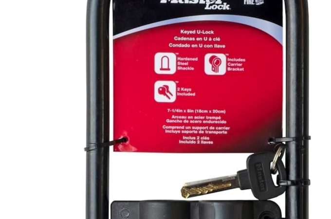 Master Lock black U-lock with keyed mechanism, shown securing a bike frame for anti-theft protection.