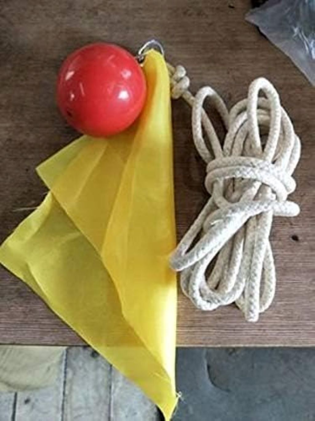 Athlete using Suzakoo rubber ball with rope in a dynamic martial arts drill, showcasing agility and coordination benefits.