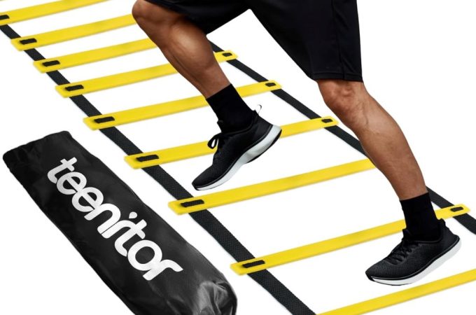 Teenitor 13-rung agility ladder laid out on grass for soccer and fitness training.