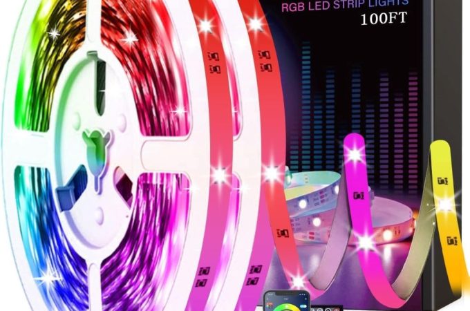 Tenmiro LED strip lights installed around a modern living room, pulsing with vibrant hues in sync with music.