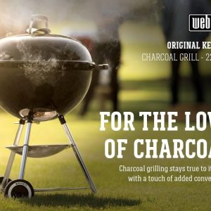 Front view of Weber Original Kettle 22″ charcoal grill with lid closed, showing compact design and durable wheels.