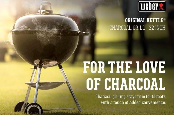 Front view of Weber Original Kettle 22″ charcoal grill with lid closed, showing compact design and durable wheels.