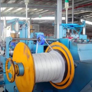 White polyester mule tape being pulled through a PVC conduit for cable installation