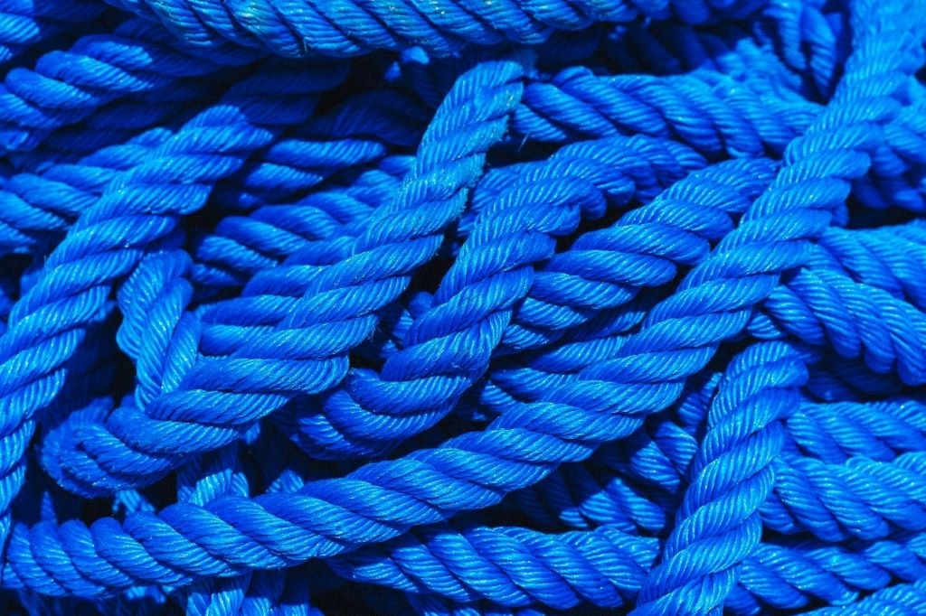 Close-up of durable ropes being used in different environments, highlighting their role in hauling and heavy-duty tasks