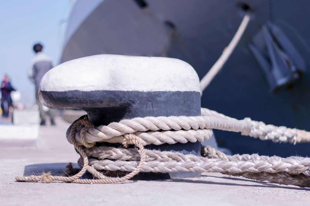 Mooring rope exposed to sun and saltwater, showing signs of wear.