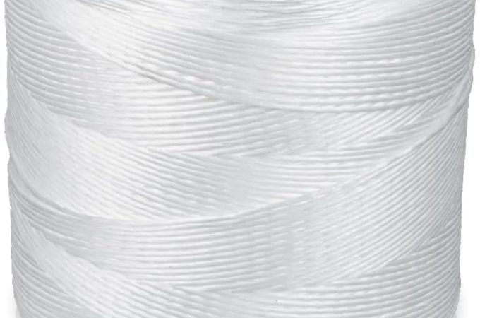 Parkway 6300 Ft white tomato twine supporting tall, healthy tomato plants in a garden.