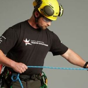 Fisherman cleaning and coiling a rope to keep it ready for daily use.