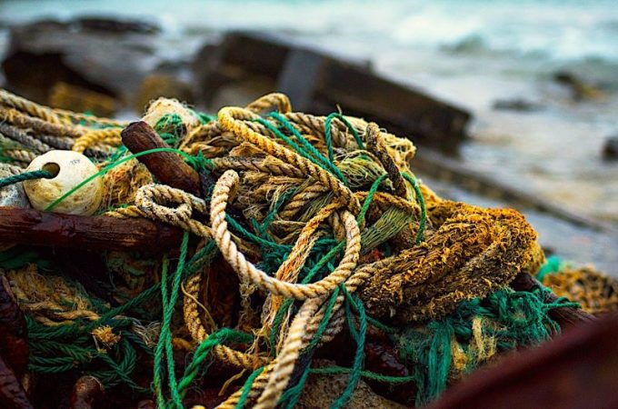 Saltwater corroding a rope on a boat, showing wear and fraying.