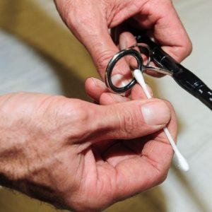 Close-up of fishing ropes being cleaned, stored, and inspected for durability.
