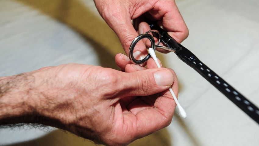 Close-up of fishing ropes being cleaned, stored, and inspected for durability.