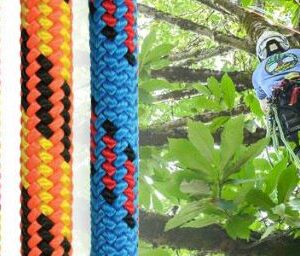Climber using kernmantle rope secured to rock climbing harness for safety.