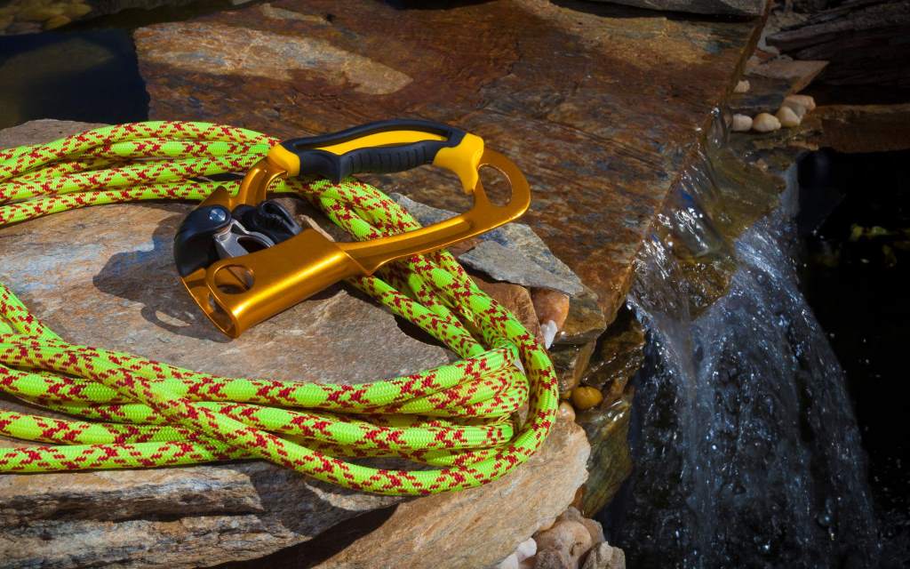 Rope and climbing gear next to water