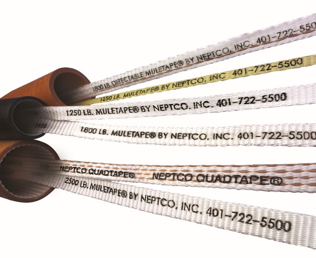 Worker using mule tape rope to pull electrical cables through conduit.