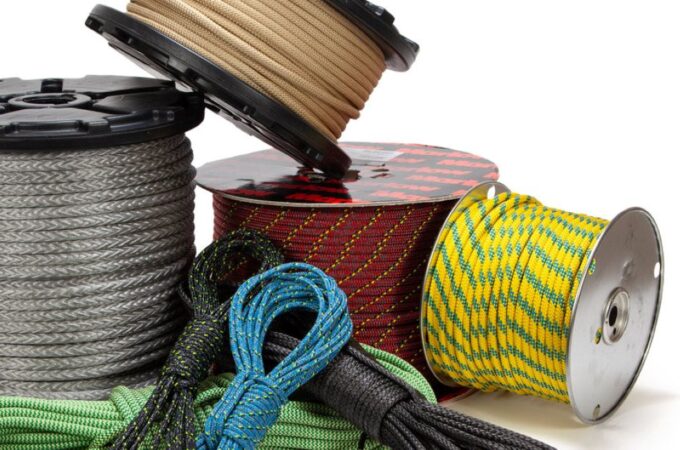 Worker selecting synthetic rope for industrial or off-road heavy-duty applications