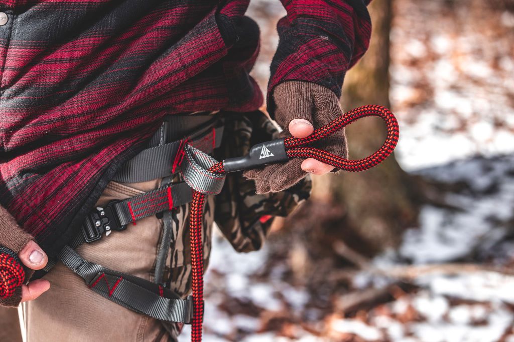 Durable rappel rope and climbing gear prepared for saddle hunting outdoors
