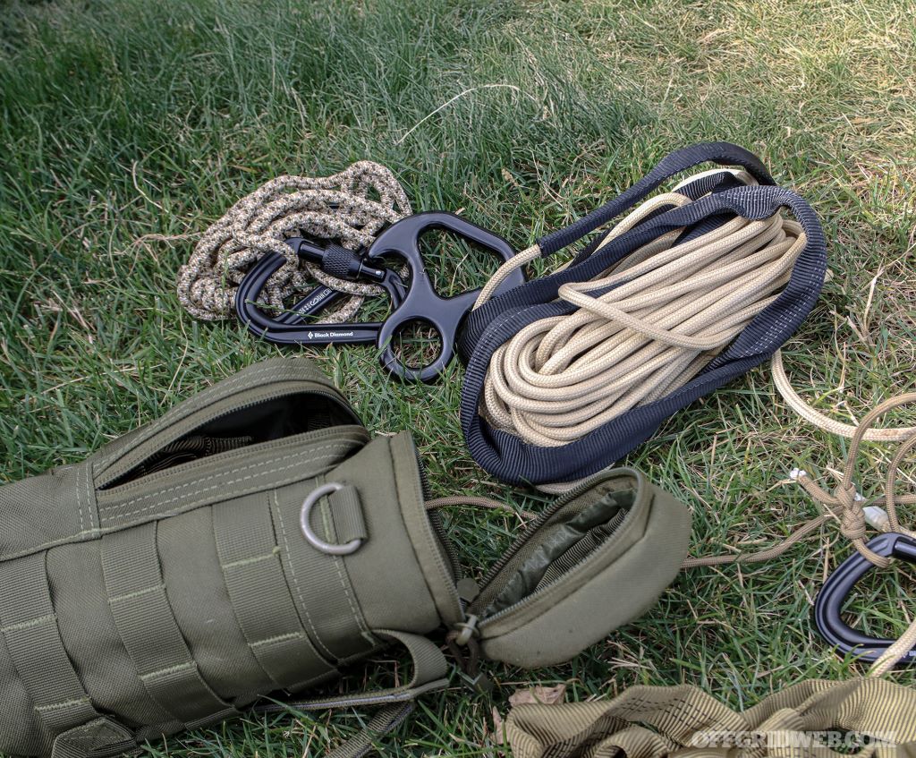 Camper using a multi-purpose rope to secure a tent during an outdoor camping trip