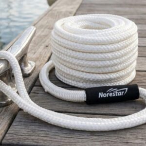 Close-up of durable dock lines tied to cleats on a boat for secure mooring