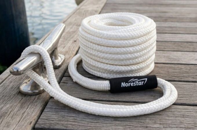 Close-up of durable dock lines tied to cleats on a boat for secure mooring