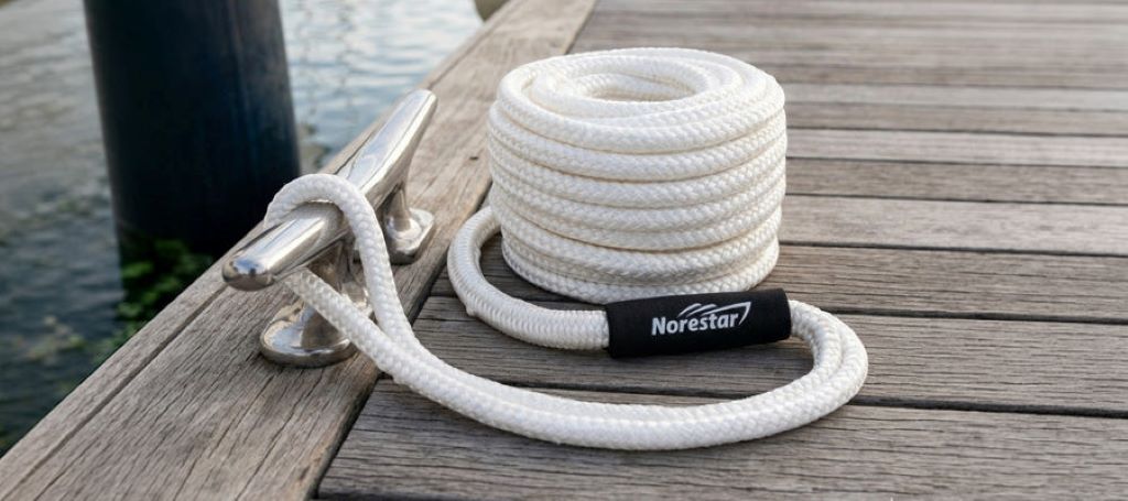 Close-up of durable dock lines tied to cleats on a boat for secure mooring
