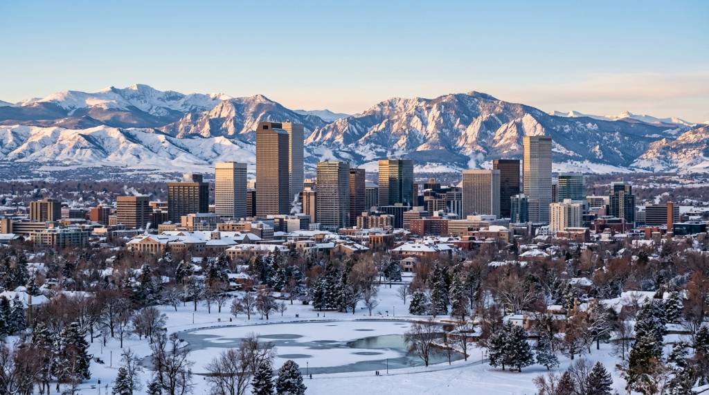 Snowy Colorado mountains behind the Denver skyline in winter